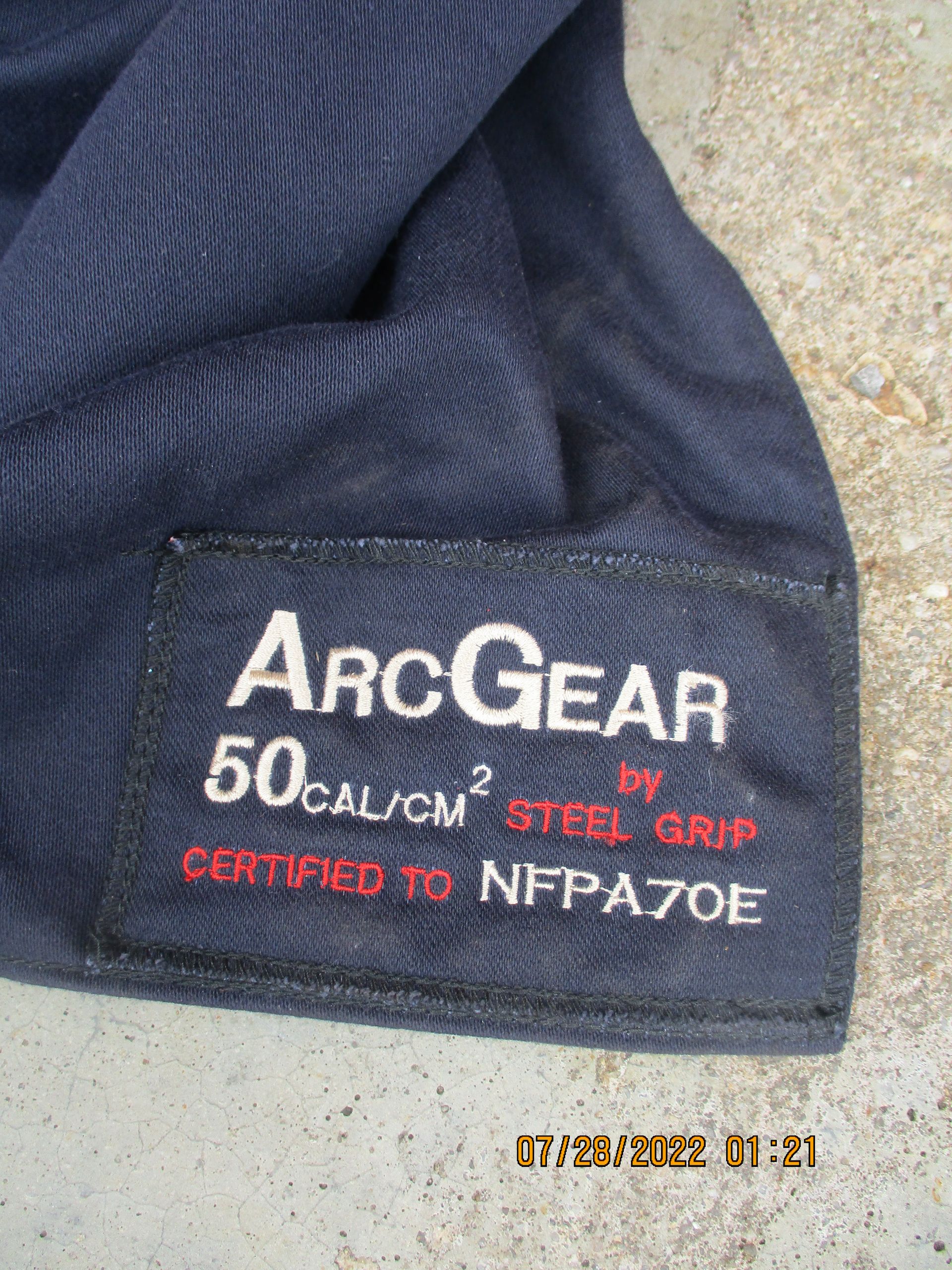 A blue shirt with a label that says arcgear on it