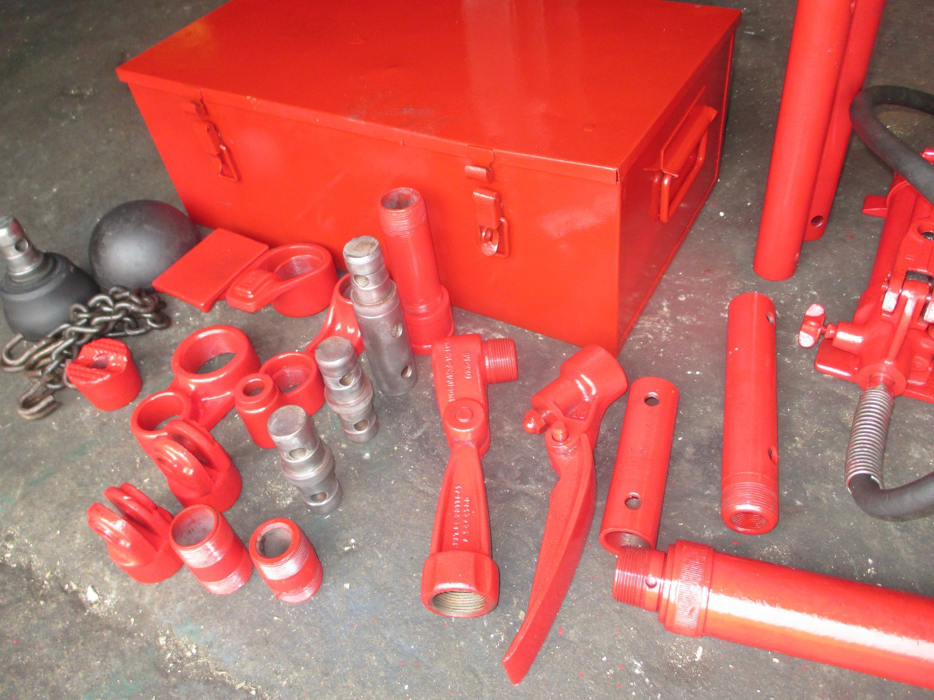 A red box is surrounded by a bunch of red tools