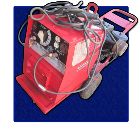 A red welding machine is sitting on a cart