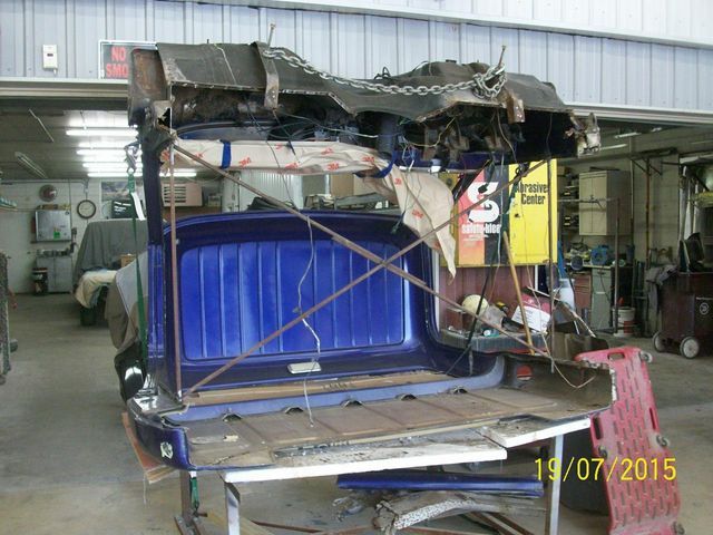 blue damaged pickup cargo bed