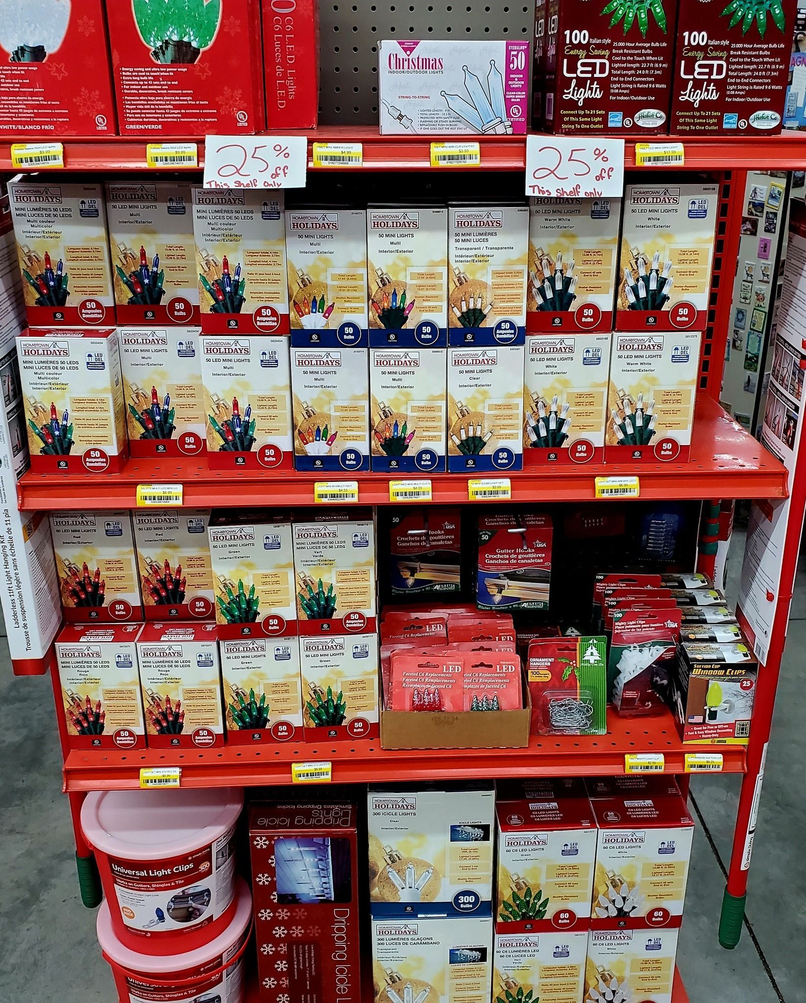 A metal store shelf filled with various boxed and tubbed food products, arranged in rows on four shelves.