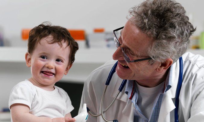 Pediatrician with a baby