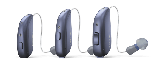 Three blue hearing aids, with connecting wires and ear pieces, displayed against a white background.