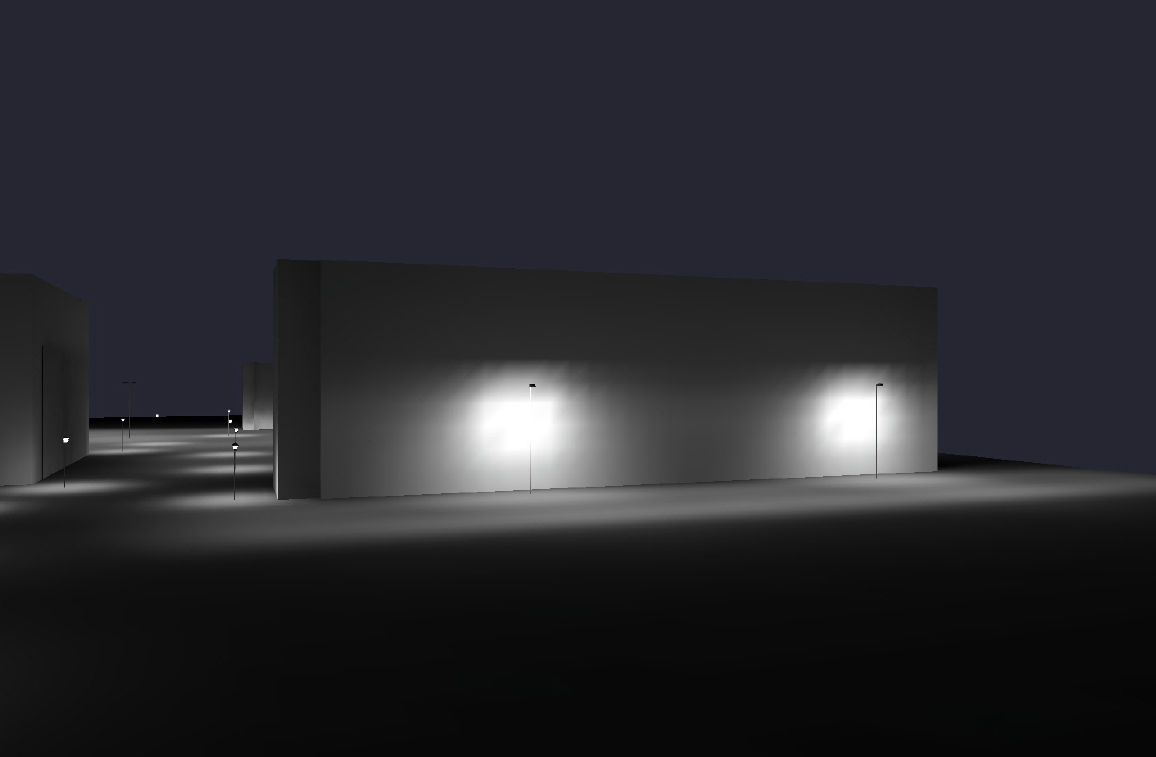 Exterior at night; illuminated concrete walls and ground by lamplight. Dark sky.
