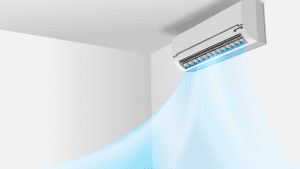 Wall-mounted air conditioner blowing cool blue air into a white room