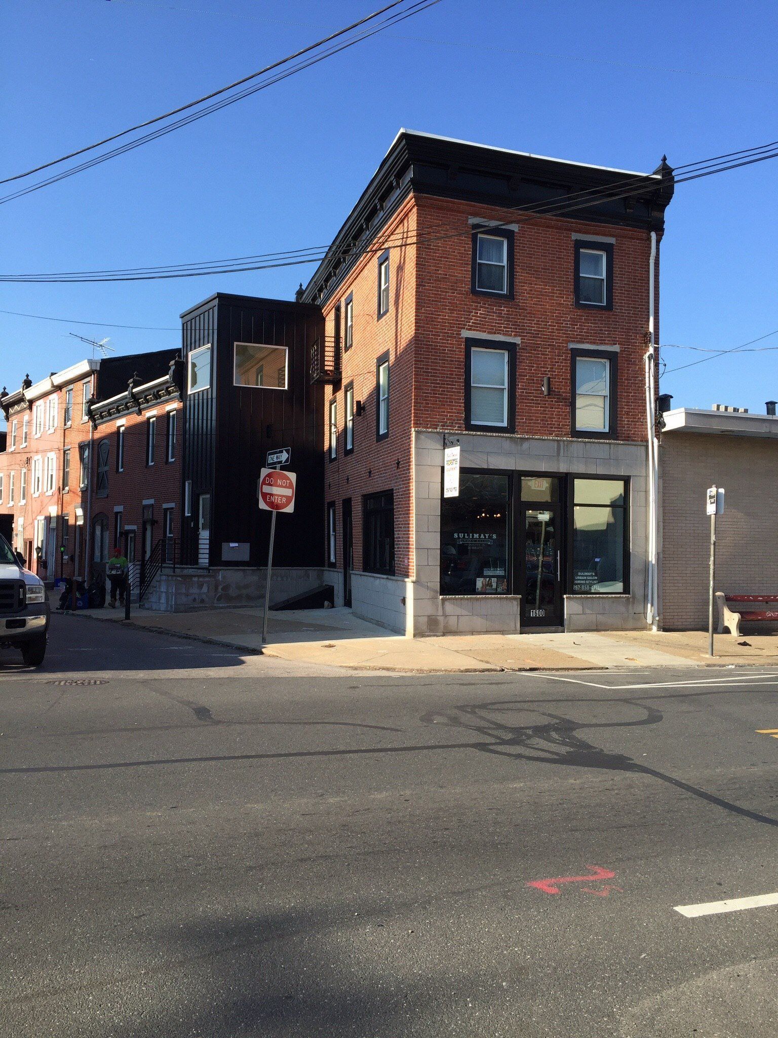 A brick building with a stop sign in front of it