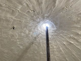 Looking up at the light at the end of a tunnel.