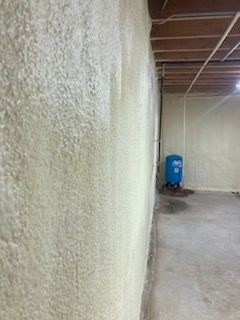 There is a blue tank in the corner of the room.