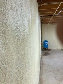 There is a blue tank in the corner of the room.