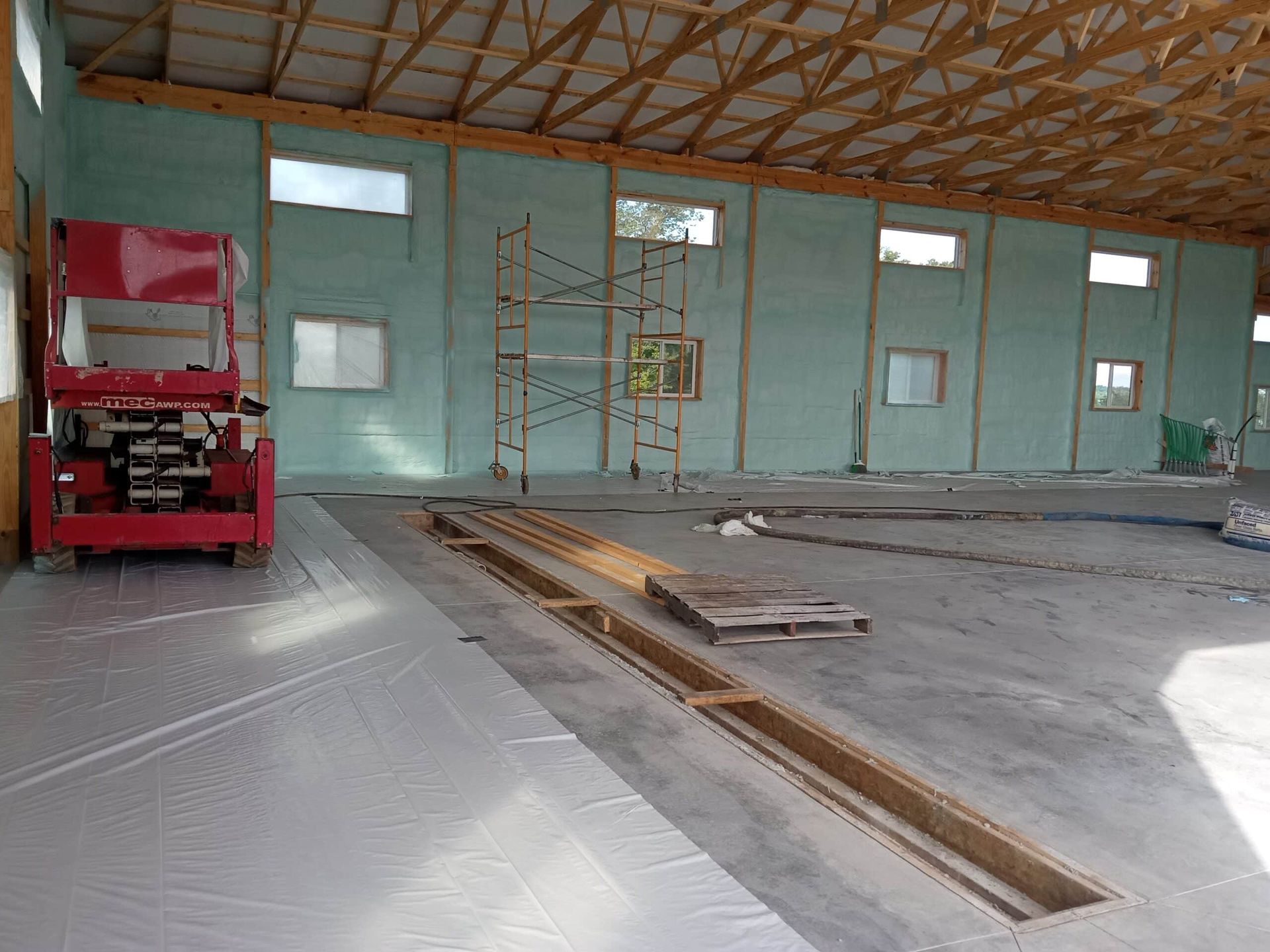 A large building with a lot of windows is being built.