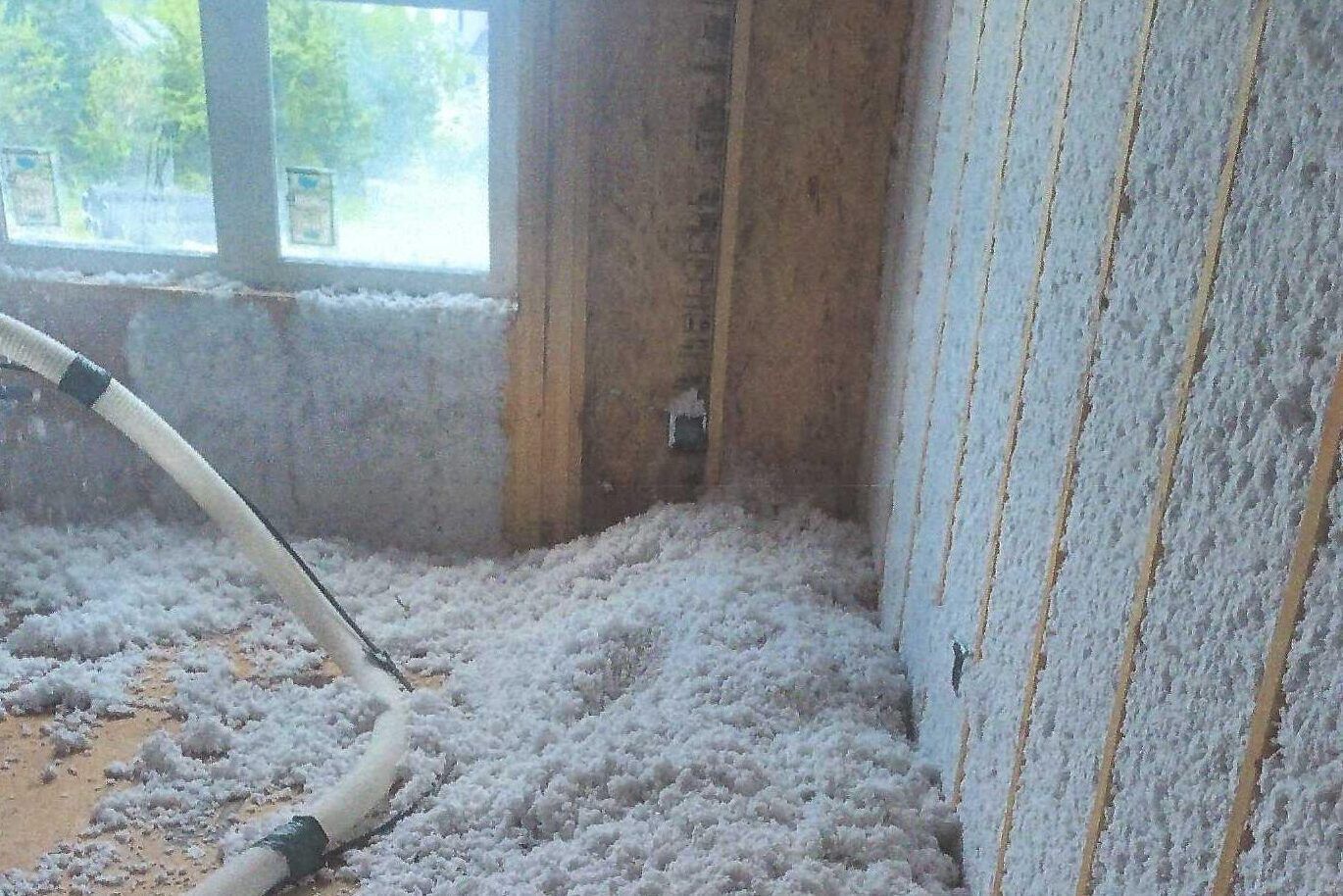 A room with a lot of insulation on the floor and walls.