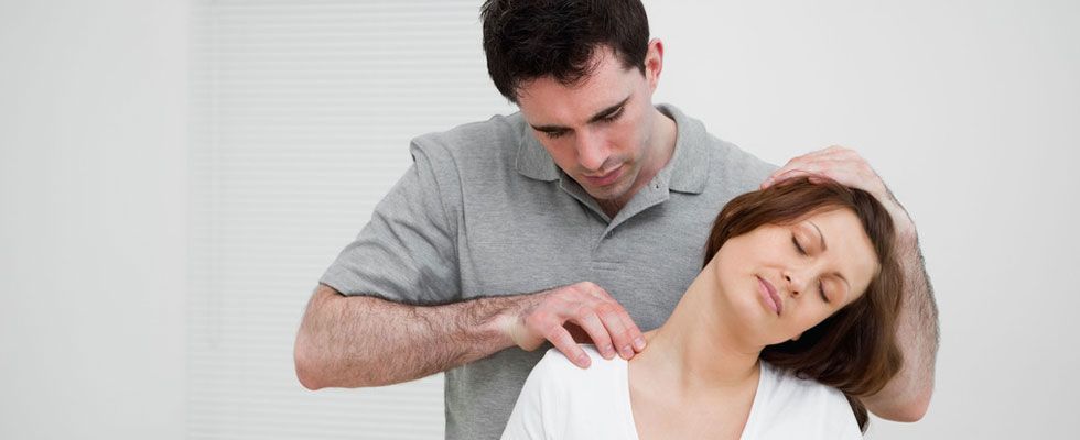 Therapist performing a neck massage