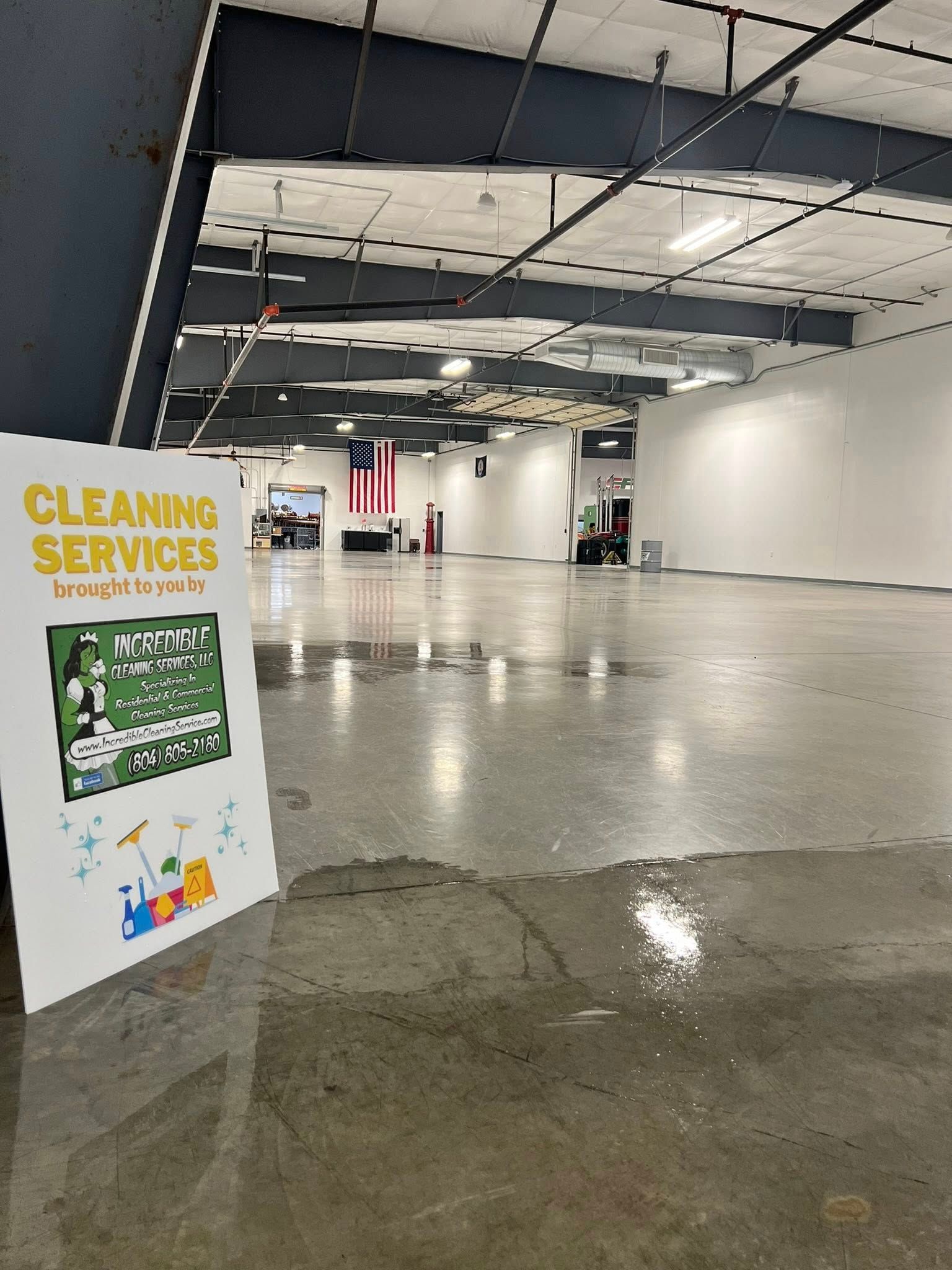 An open, empty room with a sign that says