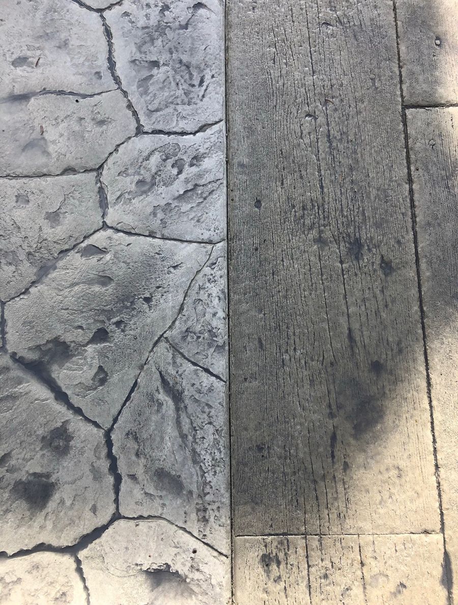 Stamped concrete with stone and wood plank patterns, in shades of gray.