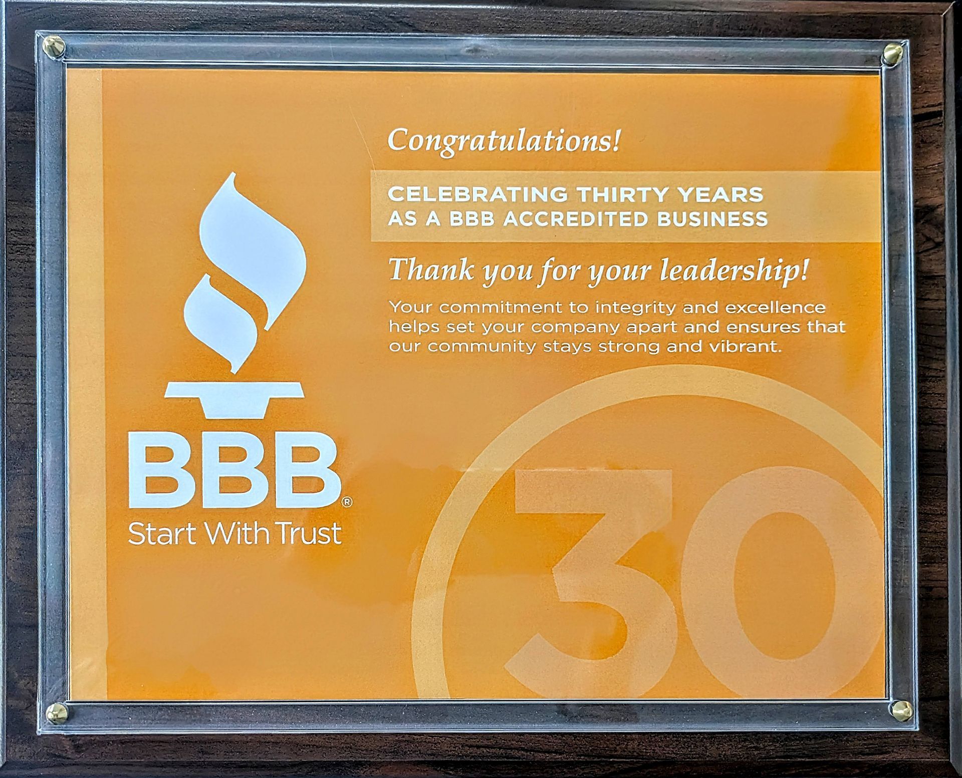A plaque that says congratulations celebrating thirty years as a bbb accredited business