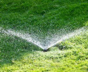 Underground Sprinkler Systems With Green Lawns