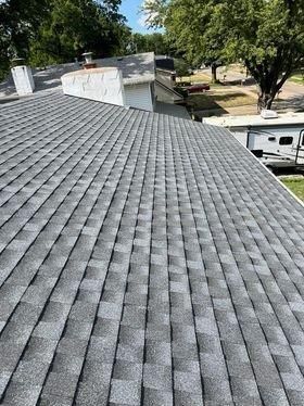 A close up of a roof with a lot of shingles on it.