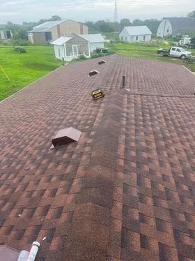 An aerial view of a roof with a lot of shingles on it.