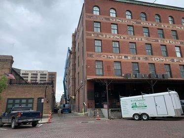 A large house with a truck parked in front of it.