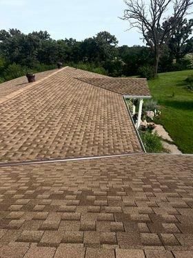 The roof of a house with a lot of shingles on it.