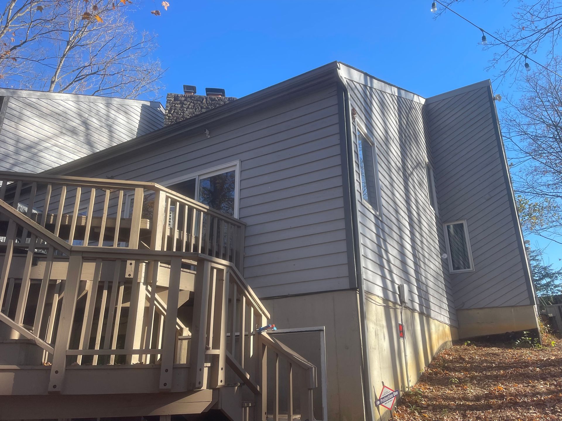 The back of a house with a deck and stairs