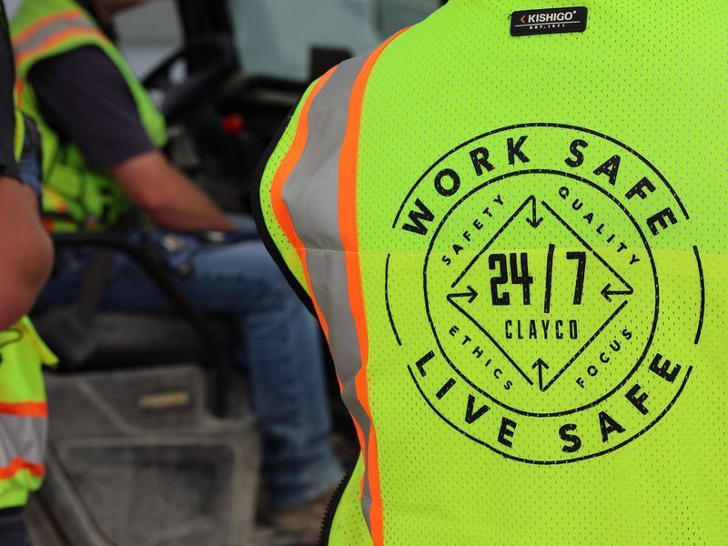 Close-up of a neon yellow safety vest with a 