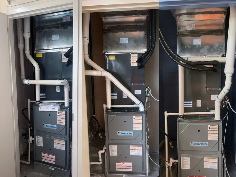 A Daikin HVAC unit installed in a utility closet, shown in three separate side-by-side views.