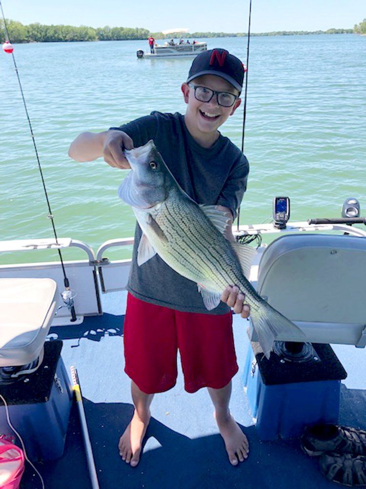 A boy who caught a big fish