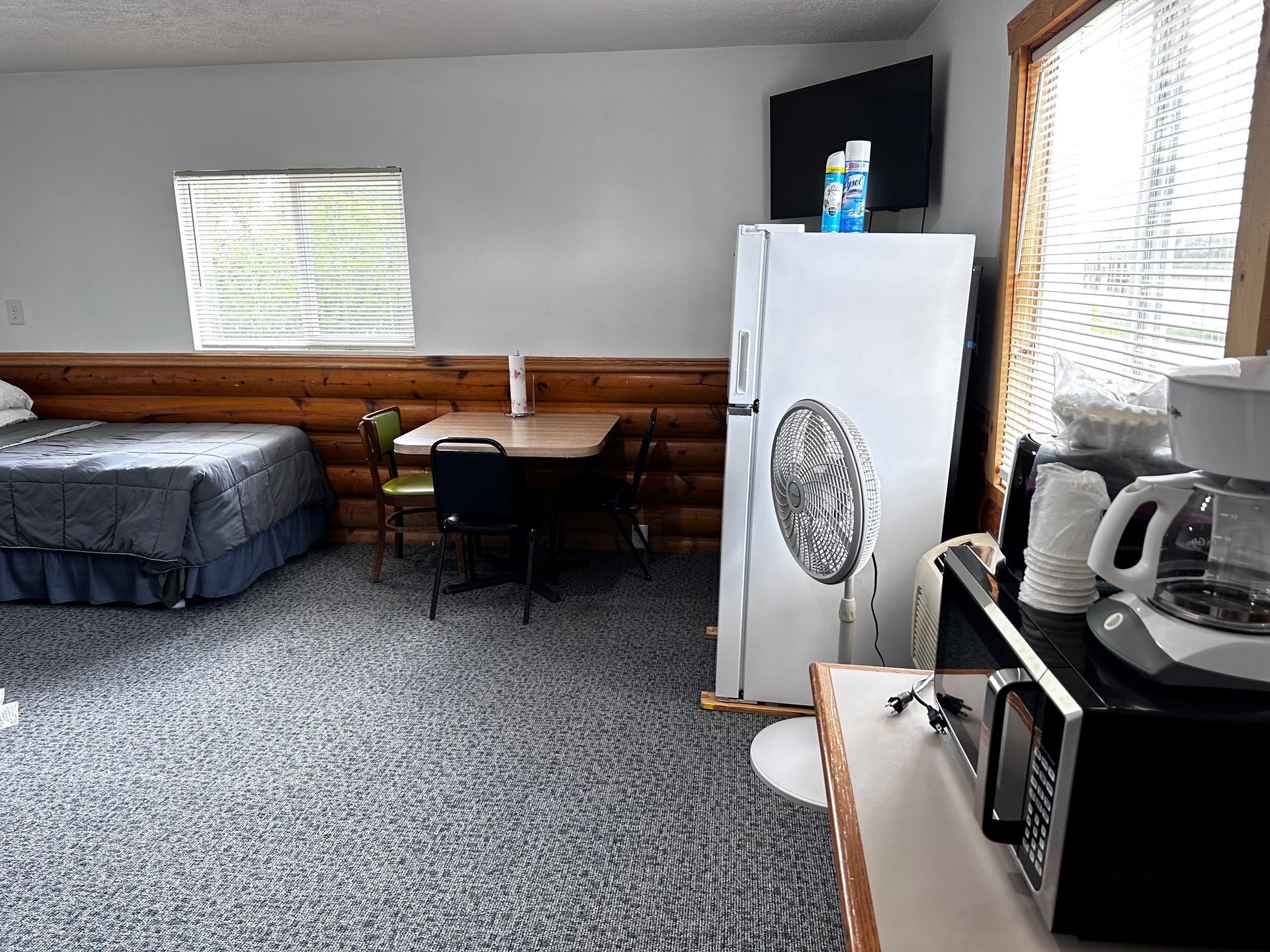 There is a refrigerator in the middle of the room.