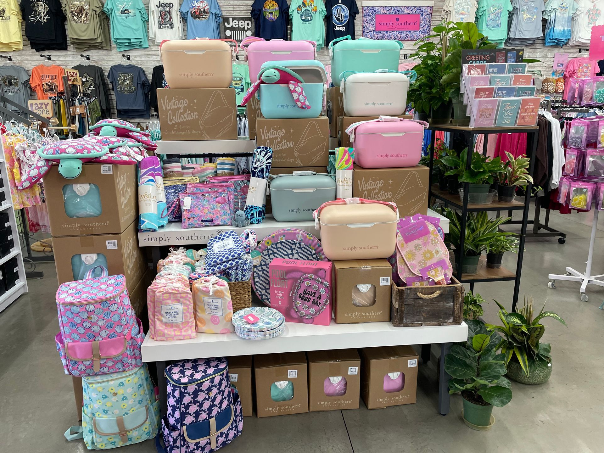 A display of luggage and backpacks in a store.