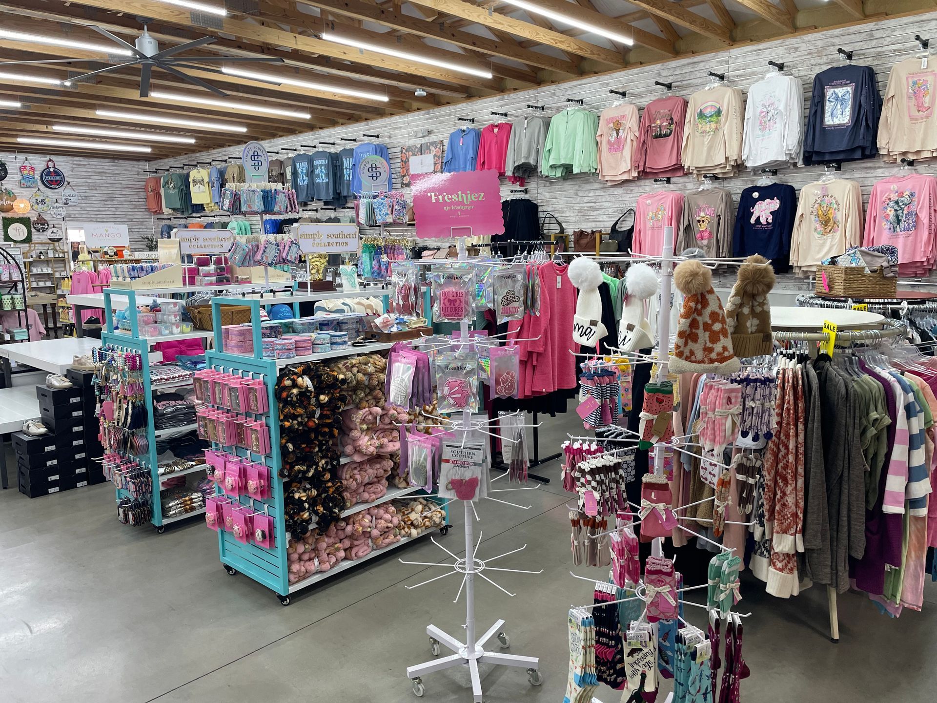 Southern Charm Garden Center in Franklin Inside store shirt racks