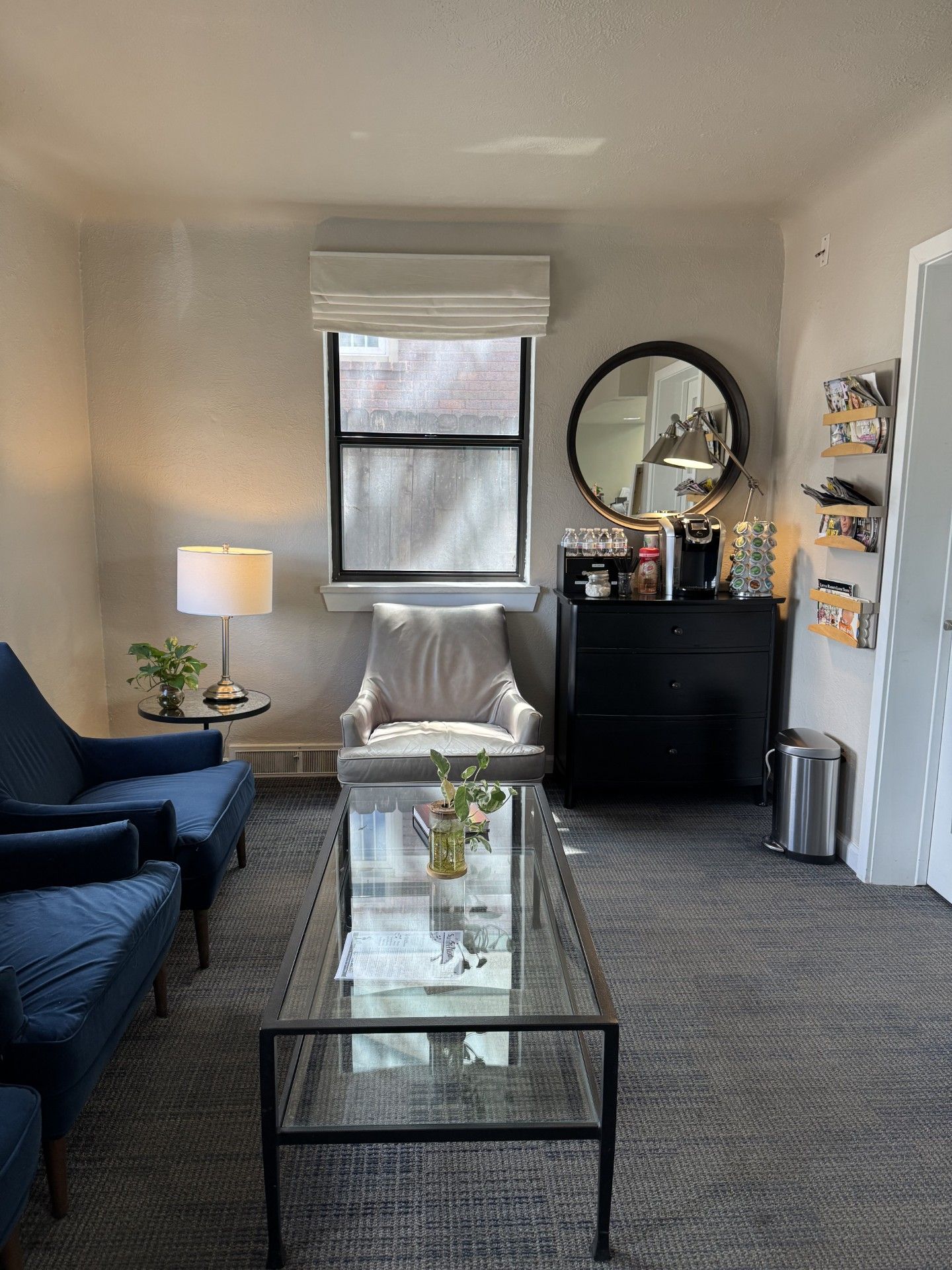 A dental office with a dental chair and a computer.