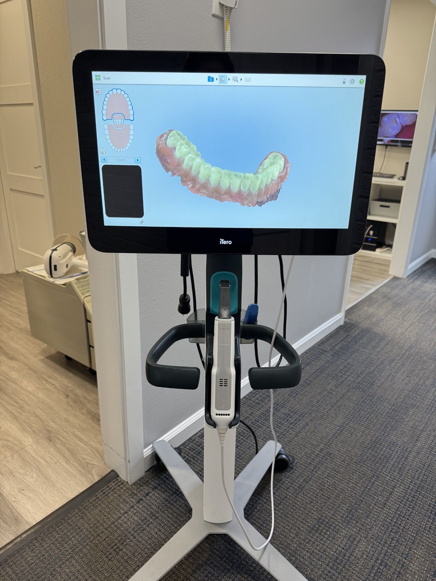 A dental X-ray machine is lying on a counter.