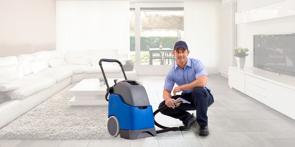 Man carpet cleaning equipment hose nozzle blue uniform