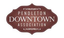 Pendleton Downtown Association logo. Brown and white text on a decorative brown frame.
