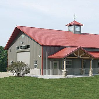 A large barn with a red roof