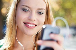 Woman listening to music on her phone