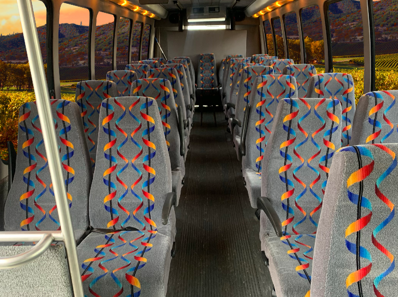 The inside of a bus with colorful seats.