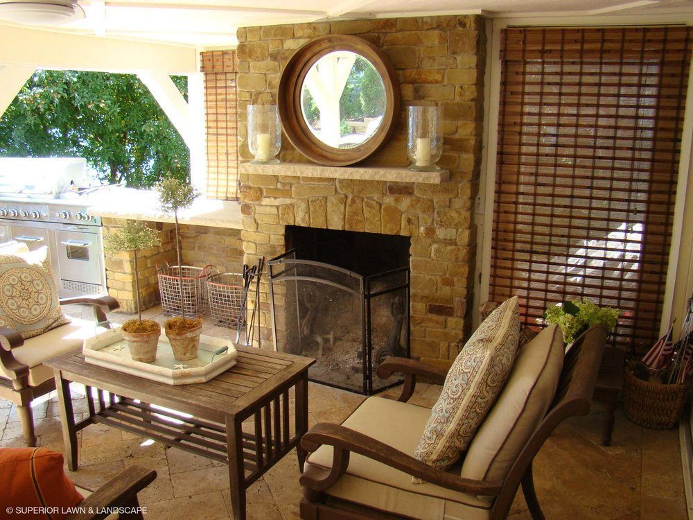 A living room with a fireplace and a mirror