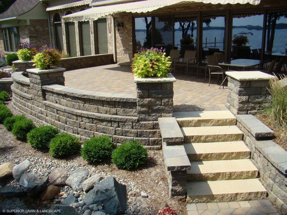 A house with a patio and stairs leading to it
