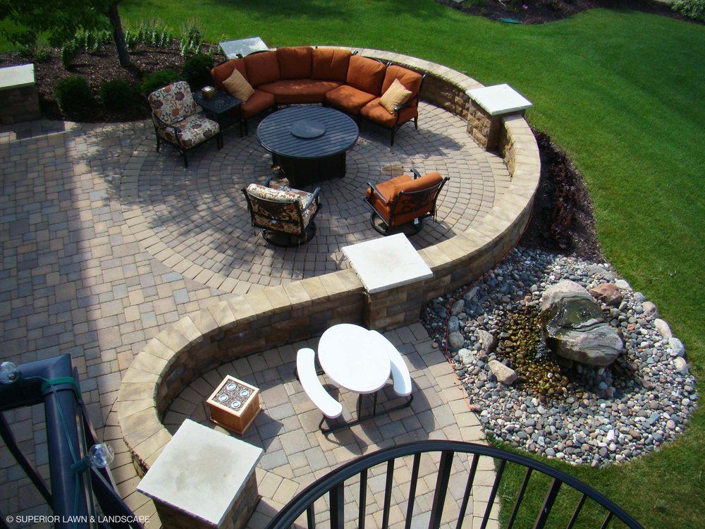 An aerial view of a patio with a couch and chairs