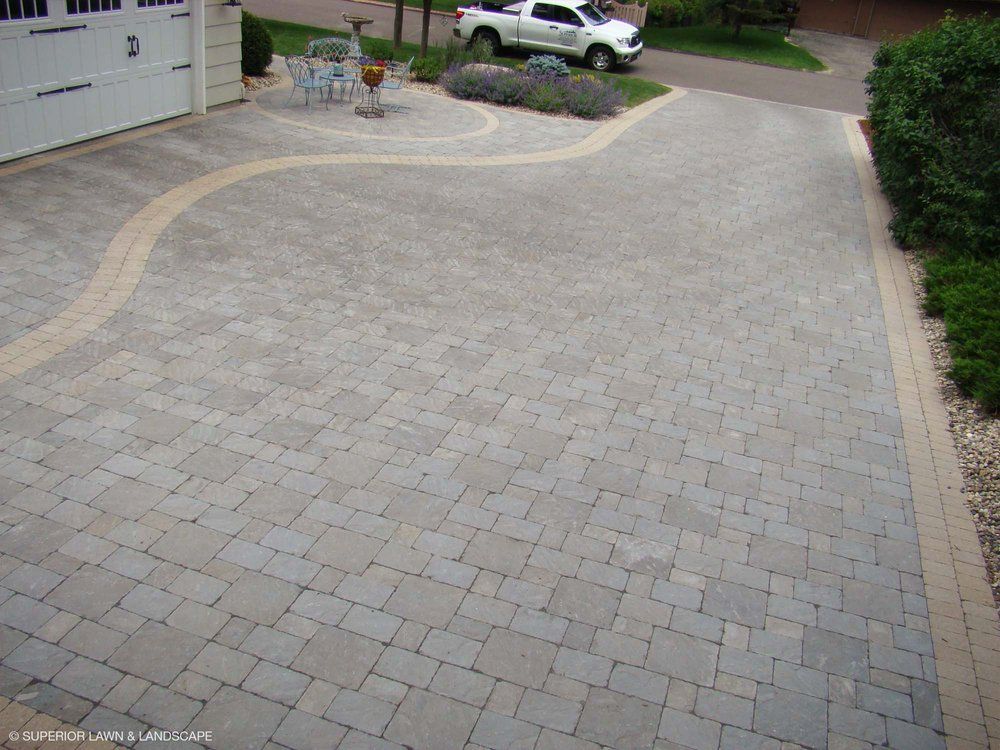 A white truck is parked in the driveway of a house