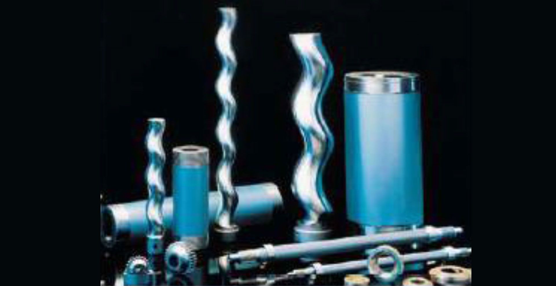 A bunch of different types of metal pipes are sitting on a table