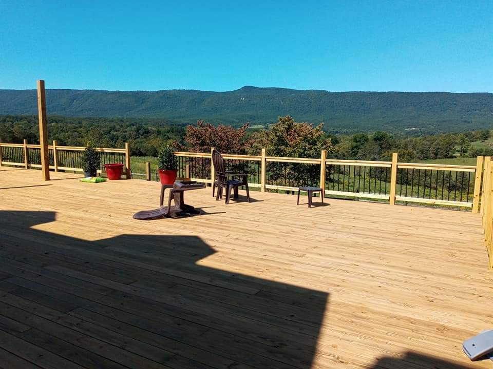 Spacious wooden deck with a beautiful outdoor view