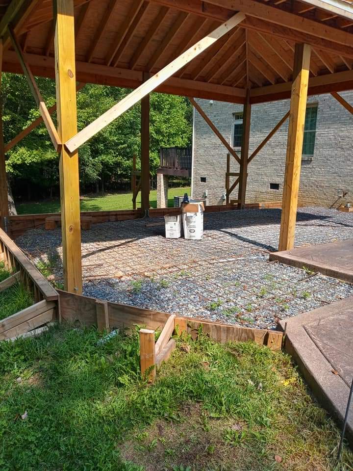 Concrete patio and a gazebo under construction