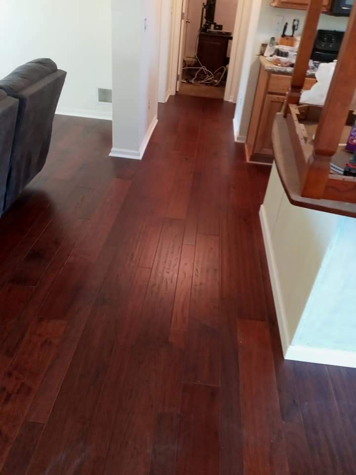 Kitchen with a red hardwood flooring