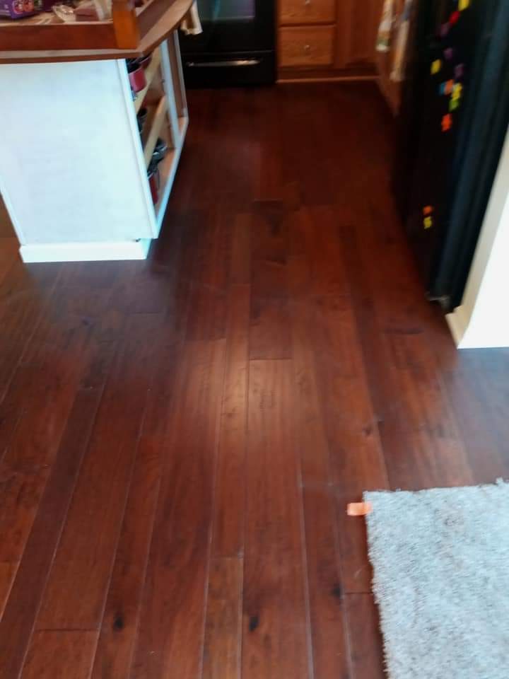 Kitchen with a red hardwood flooring