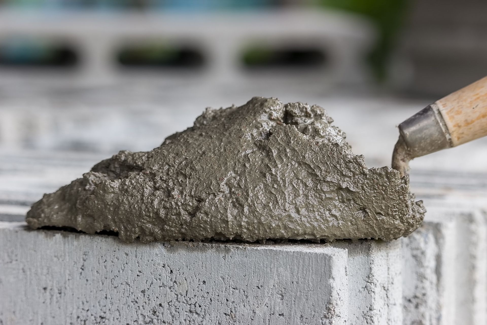 Mortar mix with a trowel on a brick