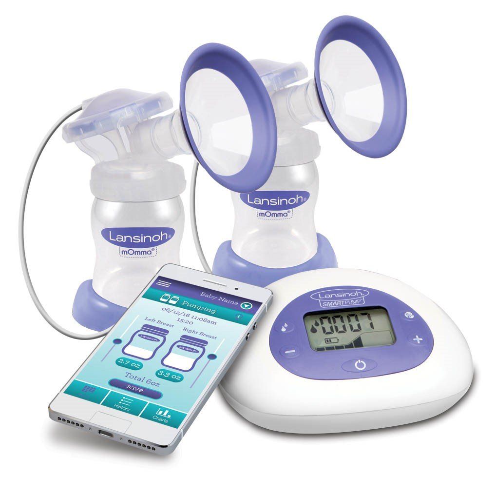 A breast pump with a cell phone next to it