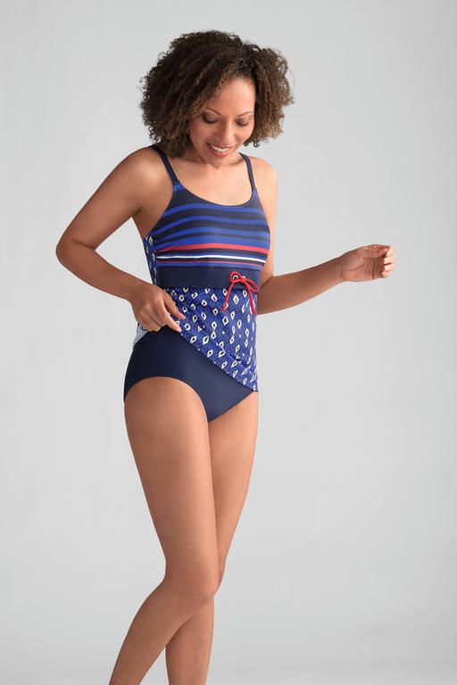 A woman is wearing a blue and red striped swimsuit.